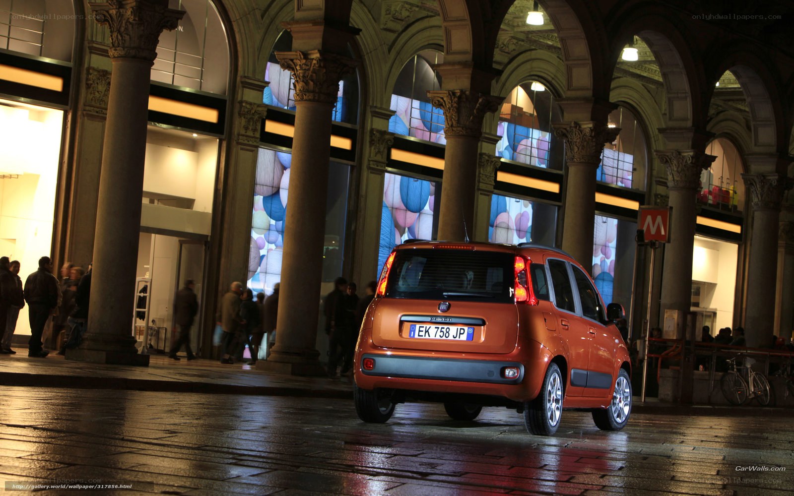 Orange car in a city arcade