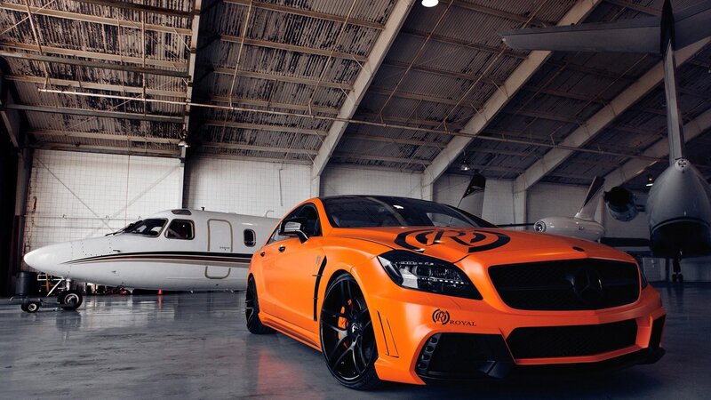 Orange car in airplane hangar