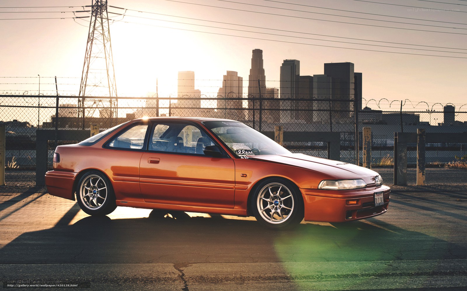 Orange car in city sunset