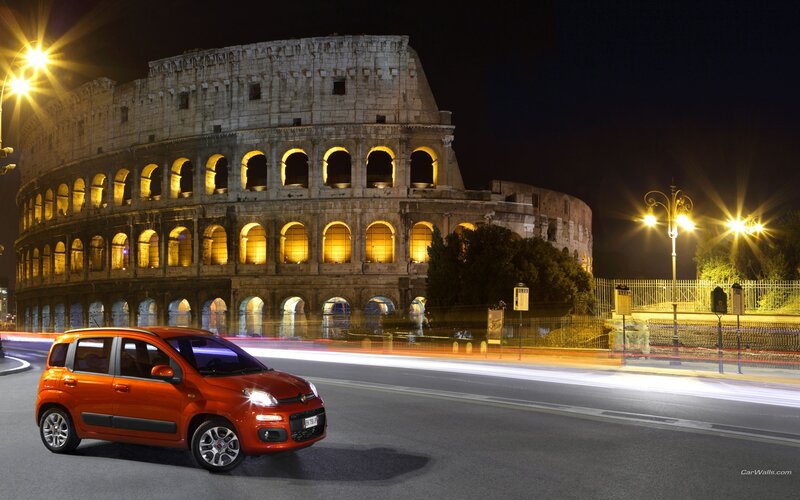 Orange car in front of Colosseum
