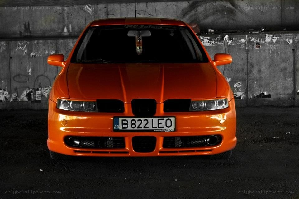 orange car in garage