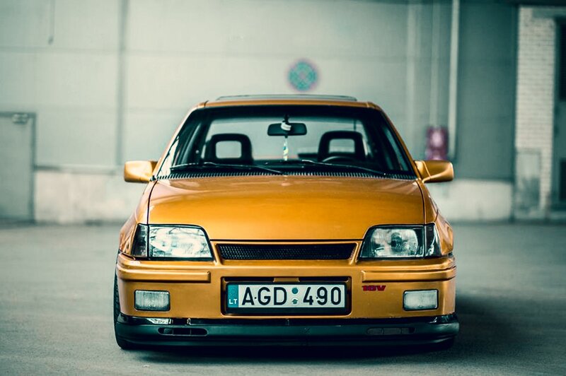 Orange Car in Garage — Dramatic
