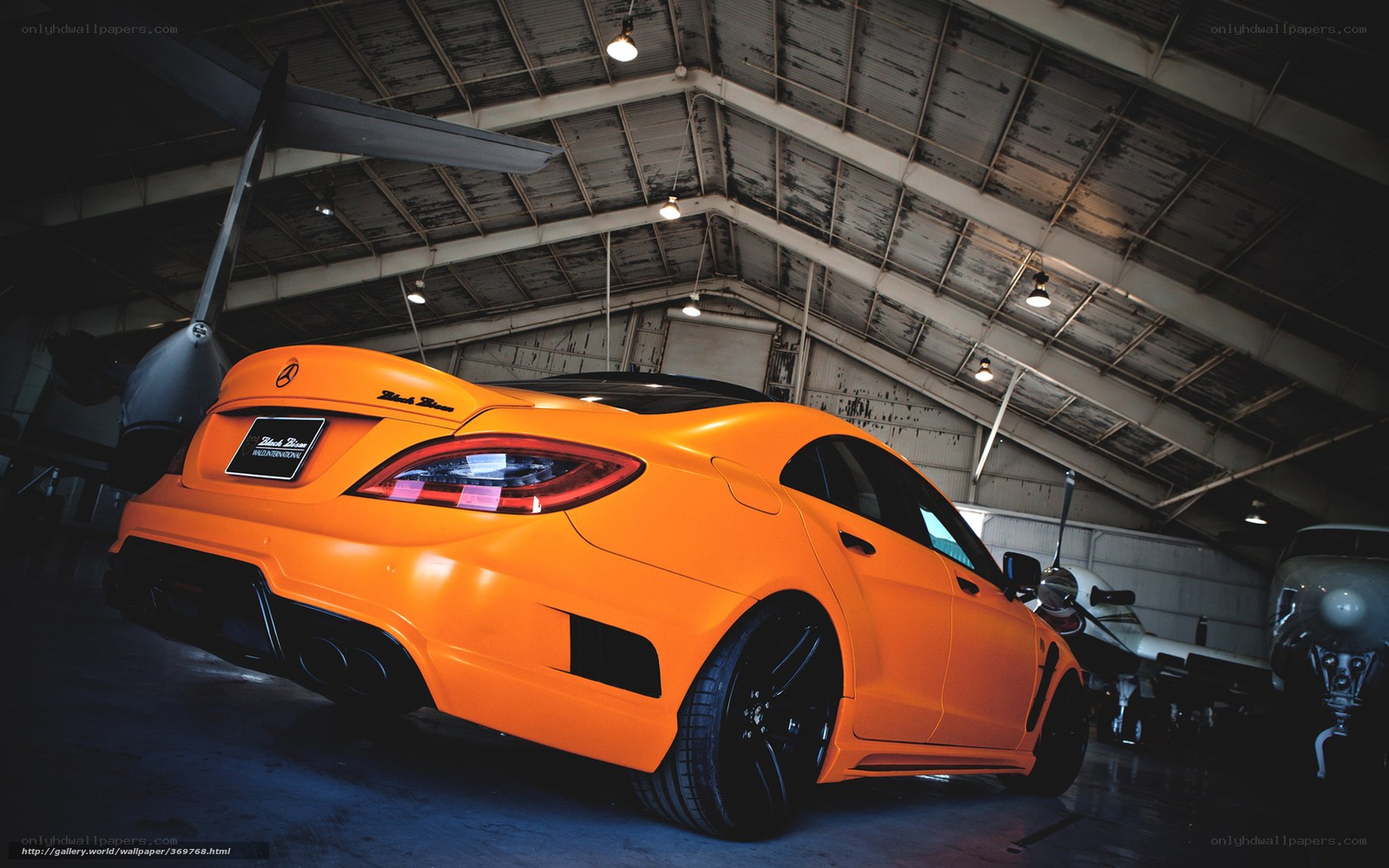 orange car in hangar