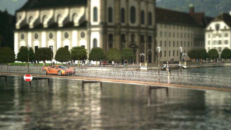 Orange car on a bridge