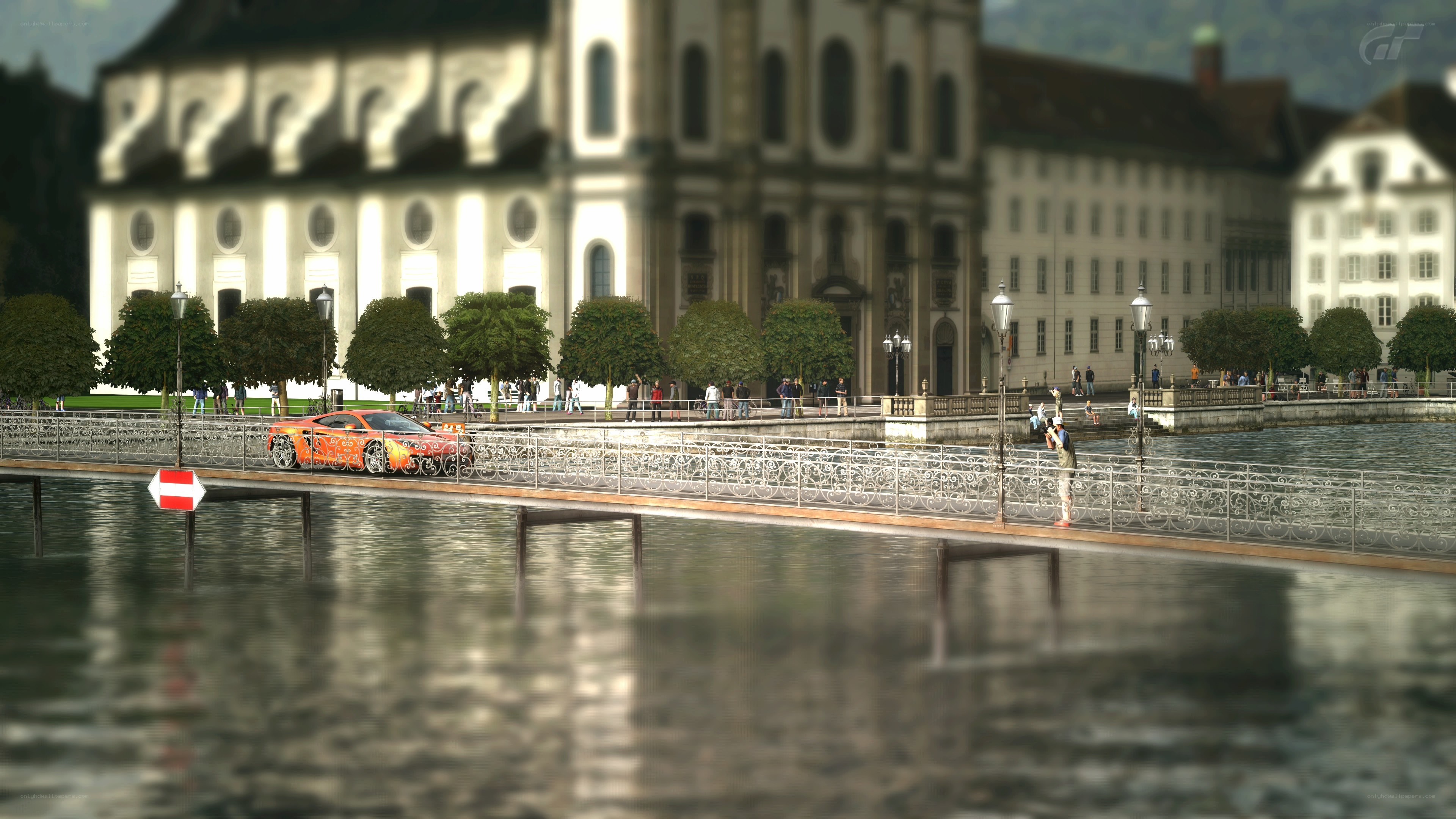 Orange car on a bridge