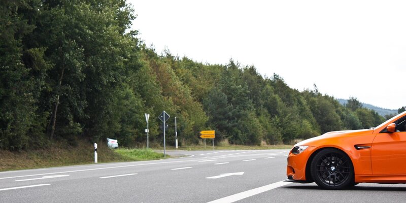 orange car on a road