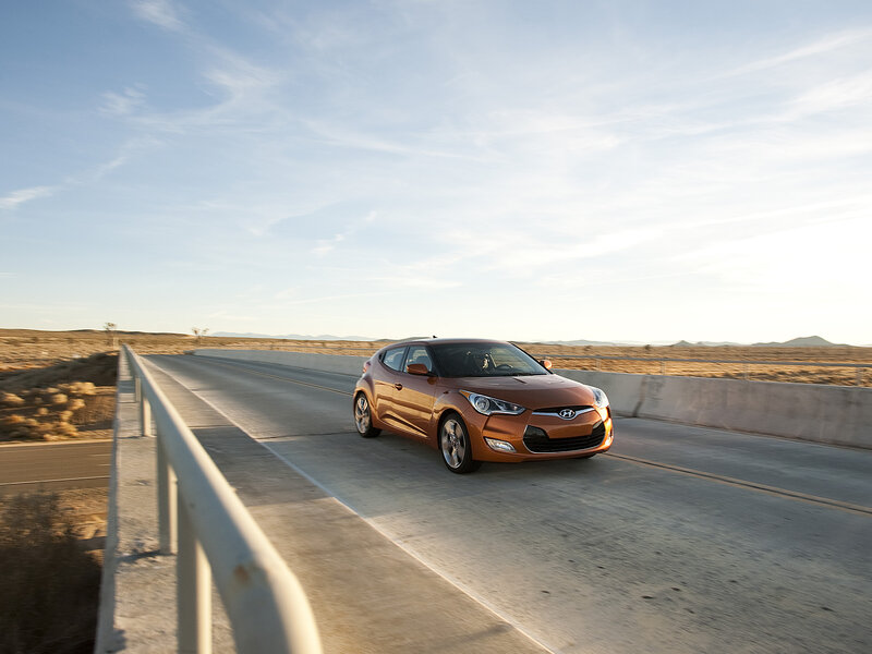 Orange Car on Bridge — Brown
