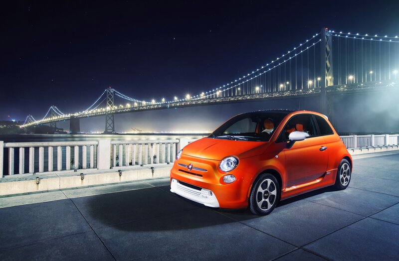 Orange Car on Bridge — Dramatic