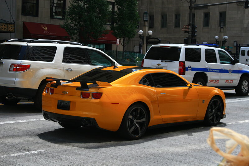 Orange car on city street