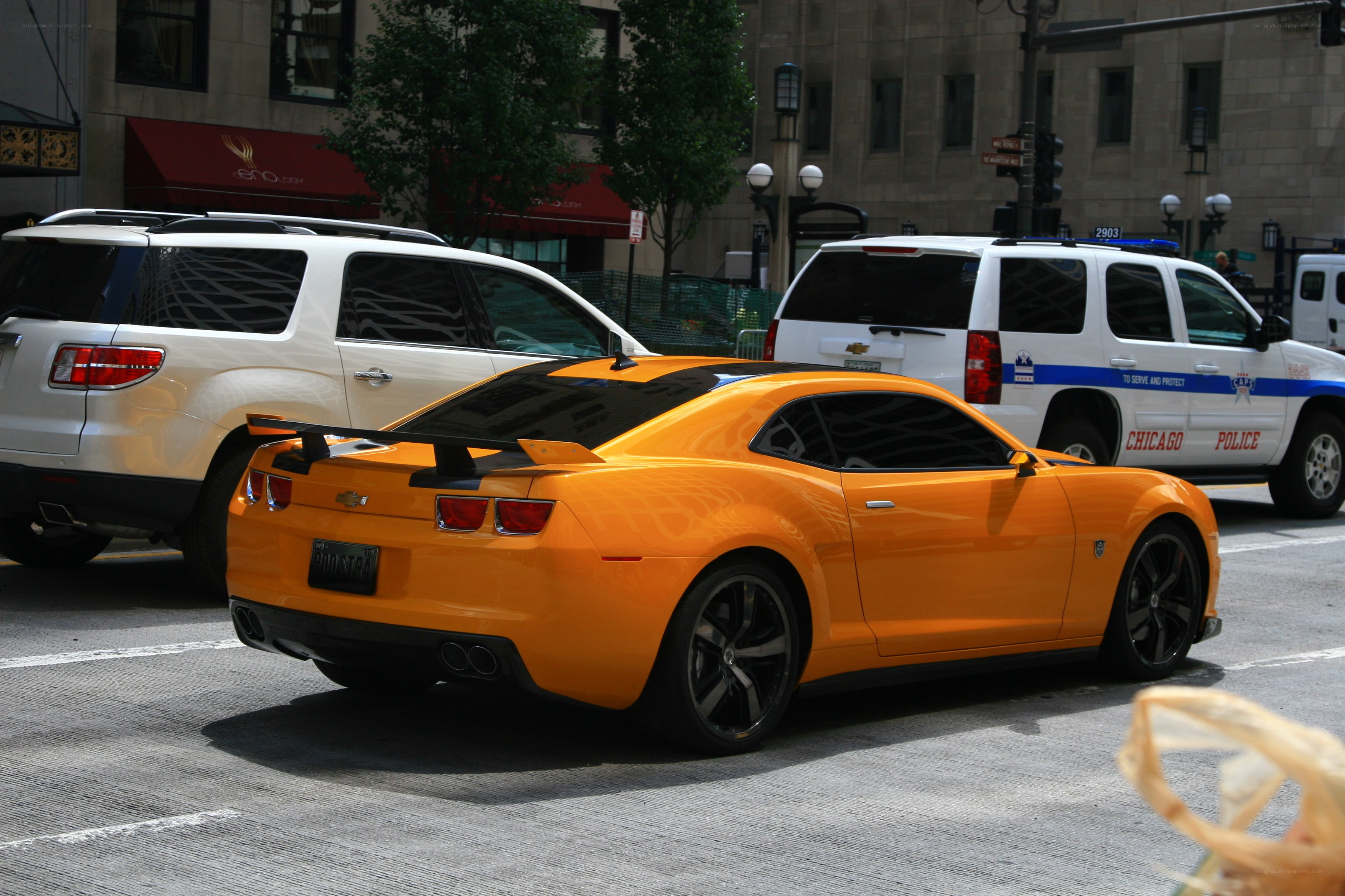 Orange car on city street