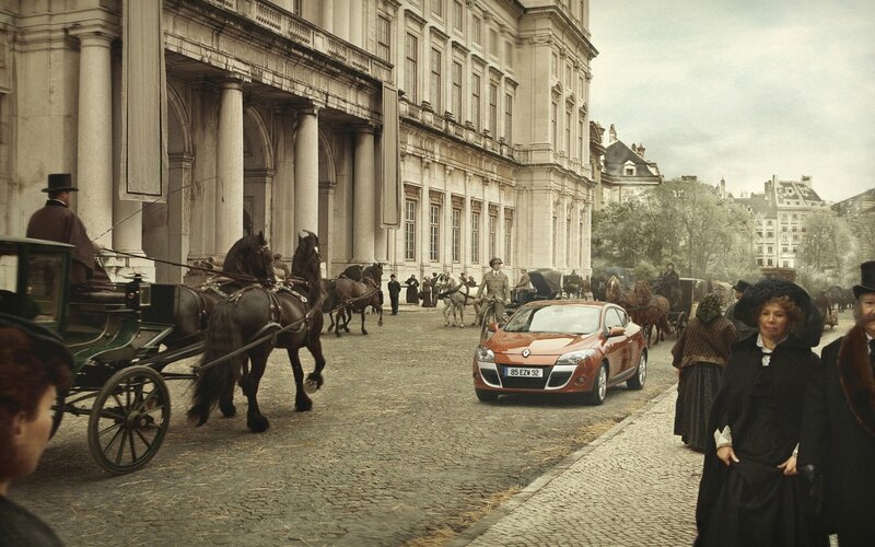Orange Car on Cobblestone Street