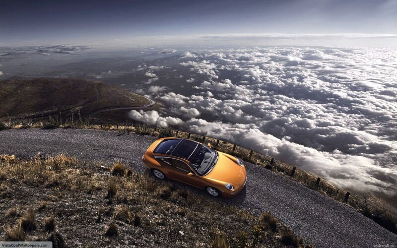Orange car on mountain road