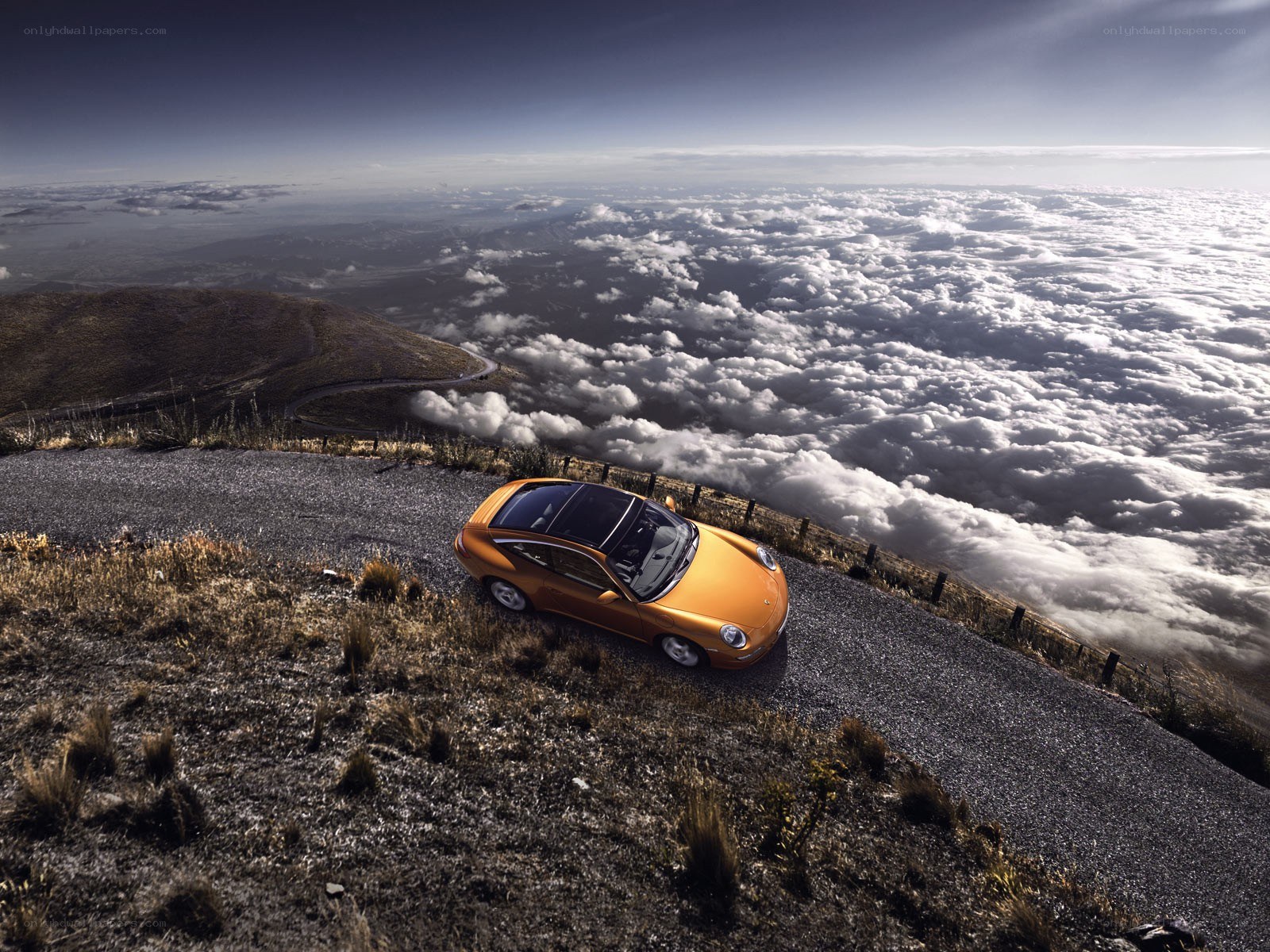 Orange car on mountain road