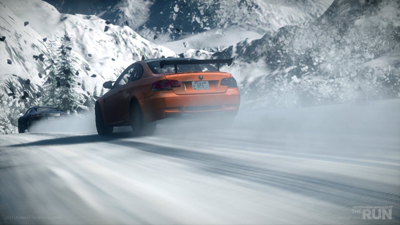 Orange car racing in snow