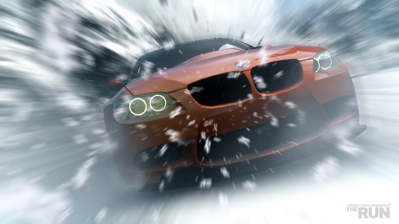 orange car speeding in snow