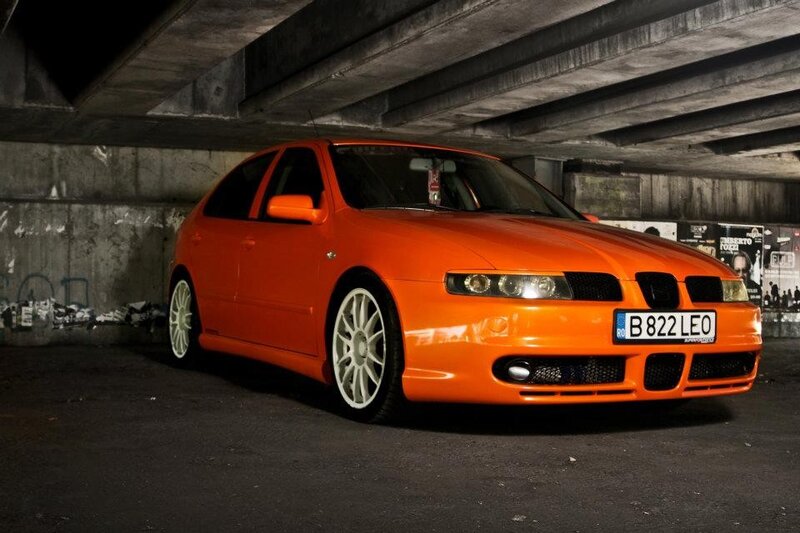 orange car under bridge