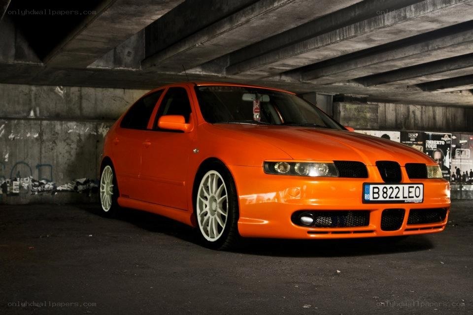 orange car under bridge