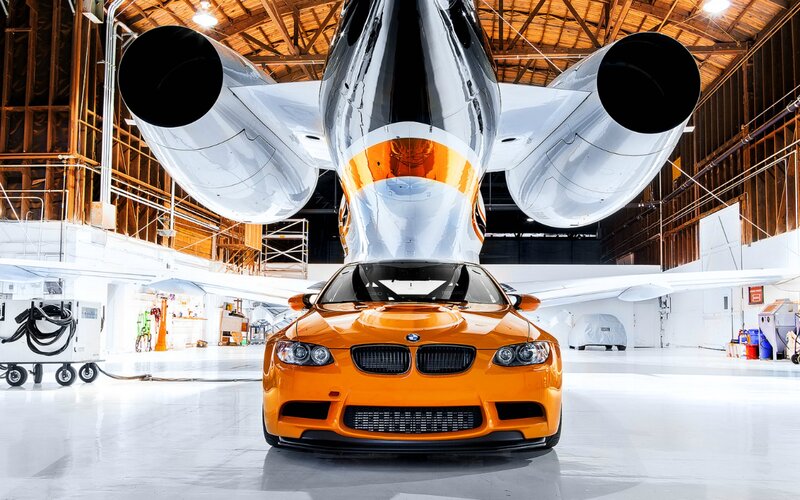 Orange Car under Plane