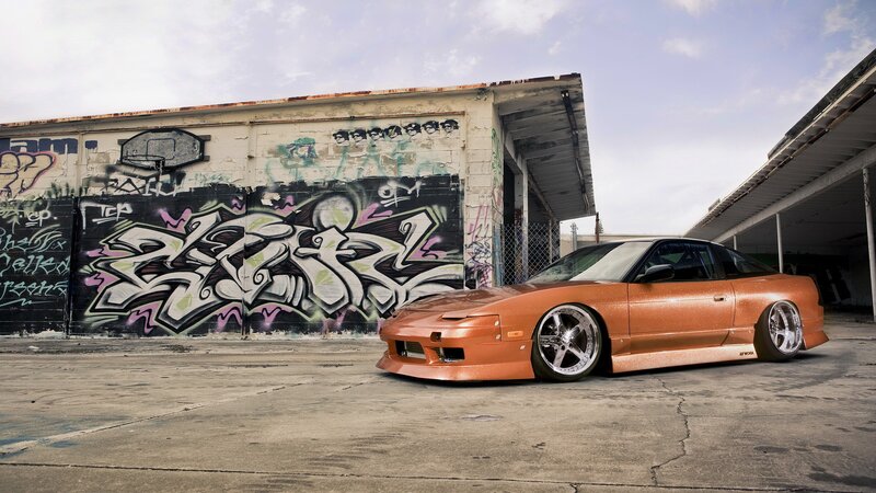 Orange car with graffiti background