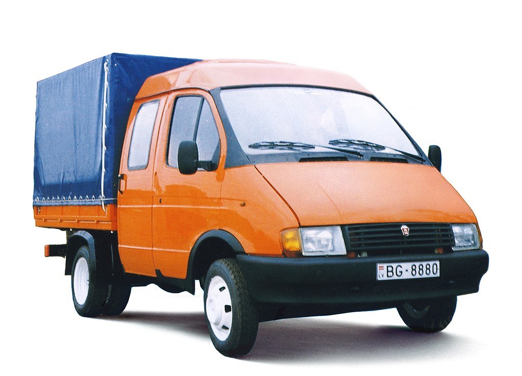 orange cargo van with blue tarp