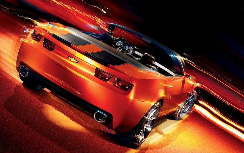 Orange Chevrolet Camaro in motion