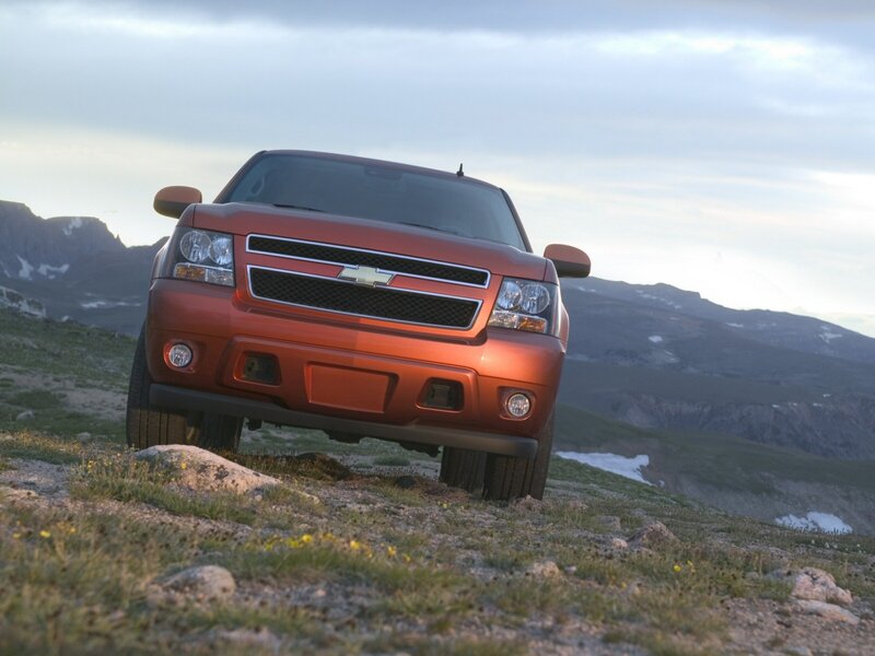 Orange Chevrolet truck on mountain
