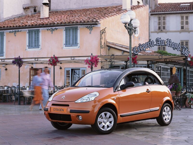 Orange Citroën C3 Pluriel in a European town