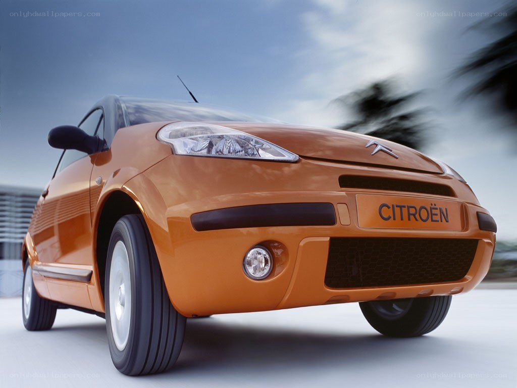 Orange Citroën car in motion