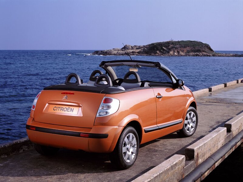 Orange Citroën convertible by the sea