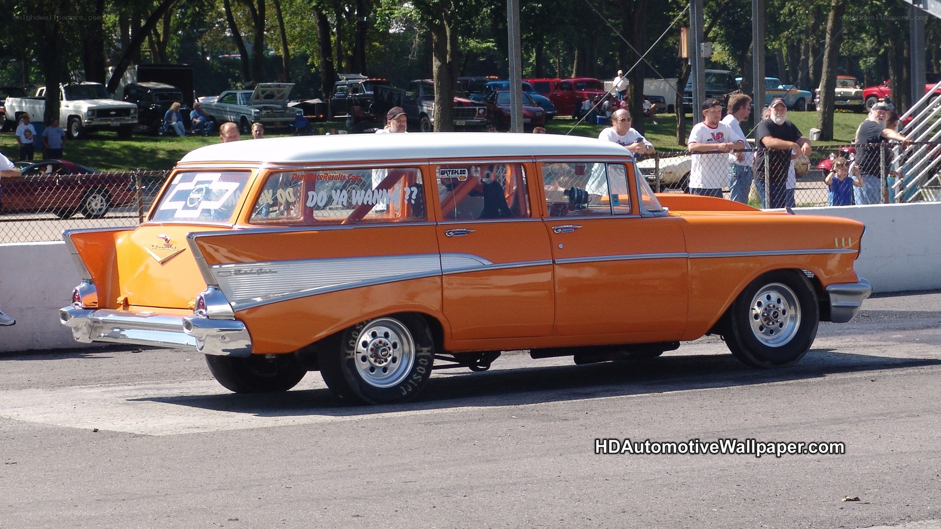 Orange classic car at a drag race