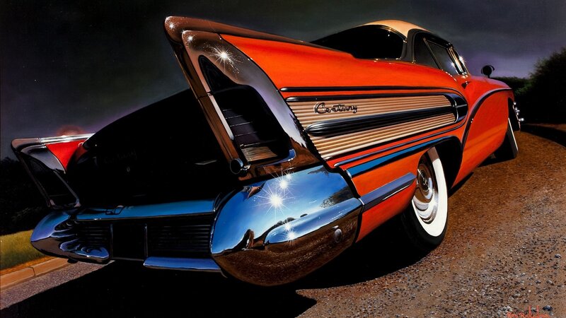 Orange classic car at night
