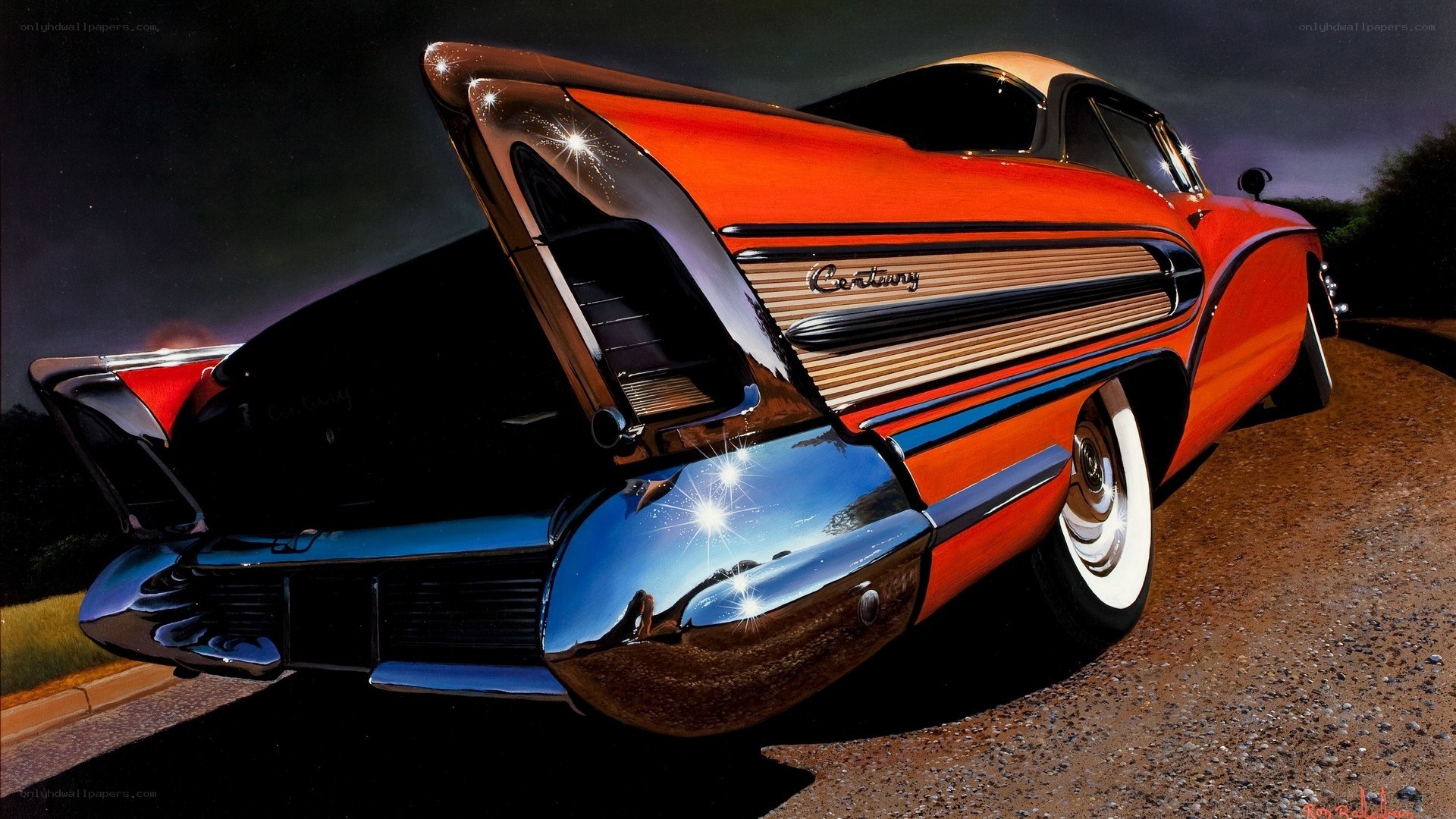 Orange classic car at night