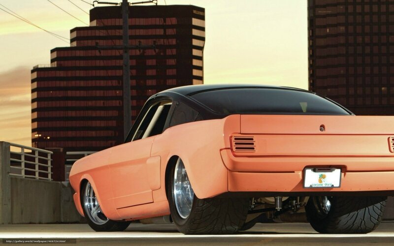 Orange classic car in city