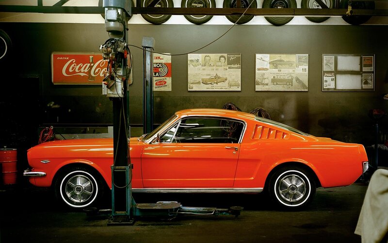 Orange classic car in garage