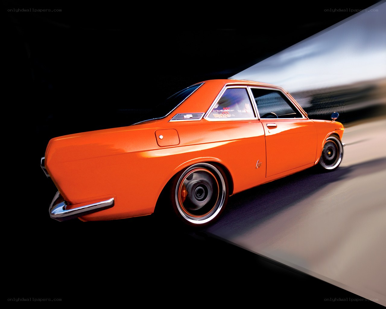 orange classic car in motion