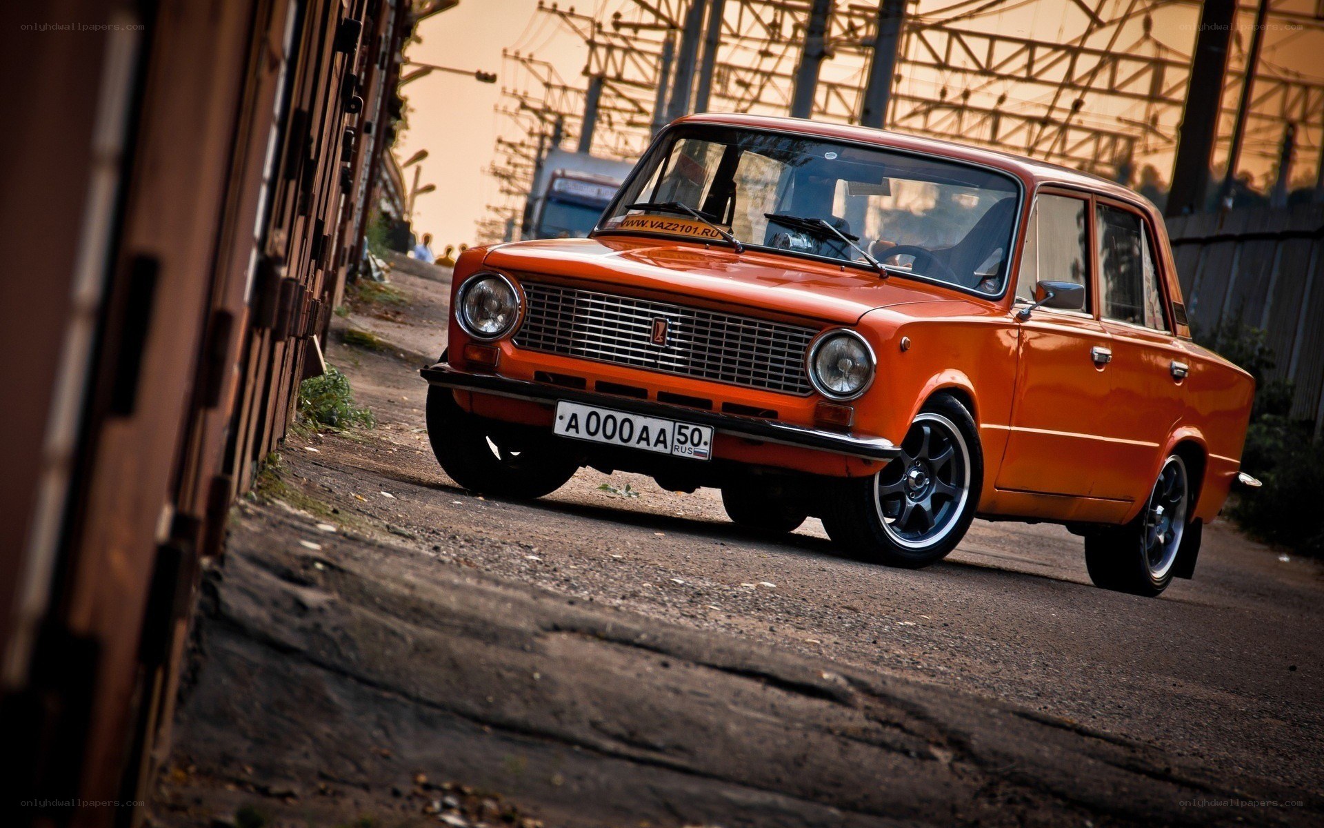 Orange classic car on a street