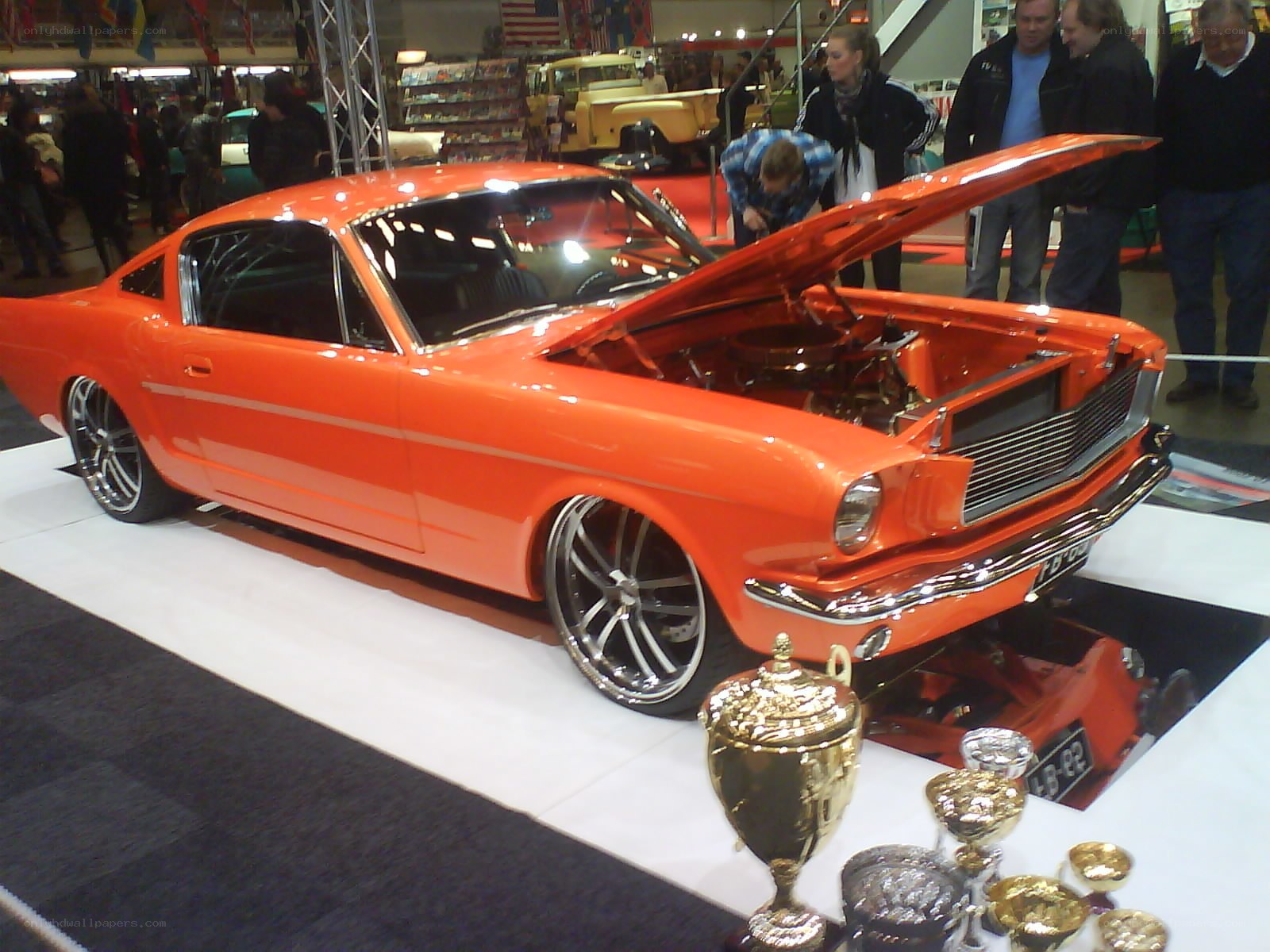 Orange classic car on display