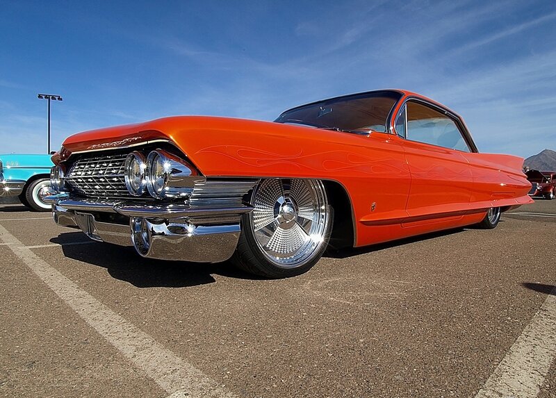 Orange classic car with custom wheels