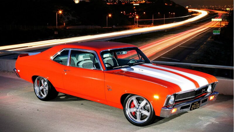 Orange classic muscle car at night
