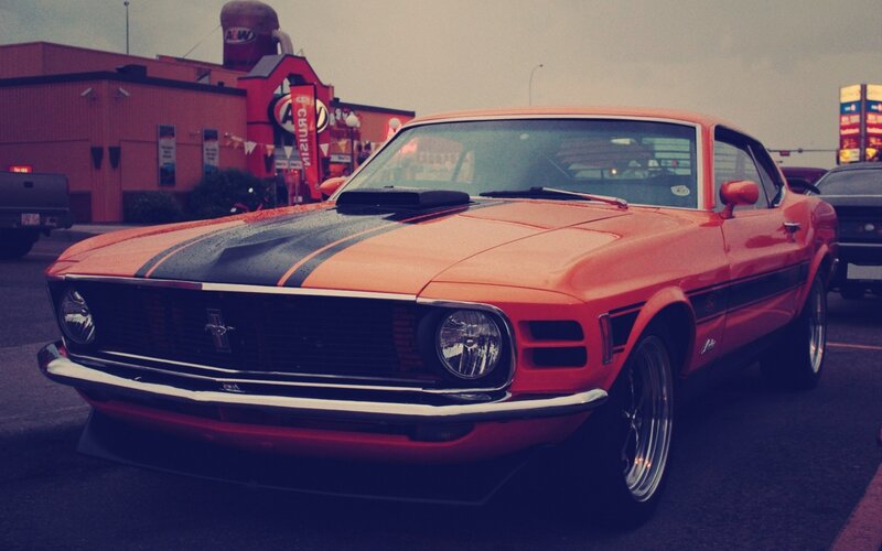 Orange Classic Muscle Car — Dramatic, Photograph, Building