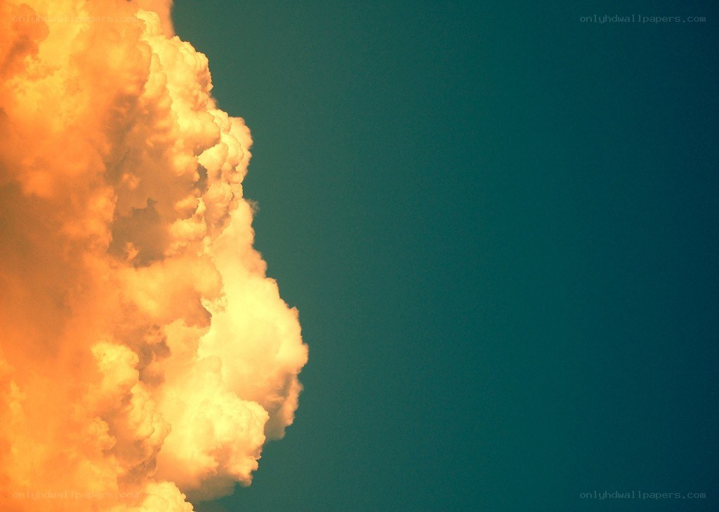 Orange cloud against blue sky