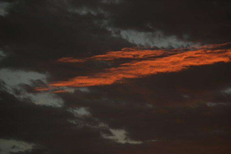 Orange Clouds in Dark Sky