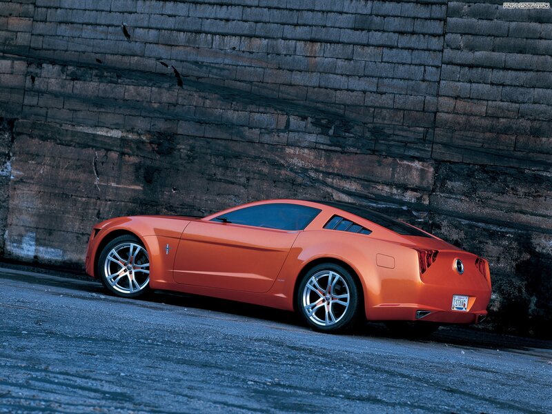 Orange Concept Car — Dramatic, Photograph, Brick Wall, Asphalt