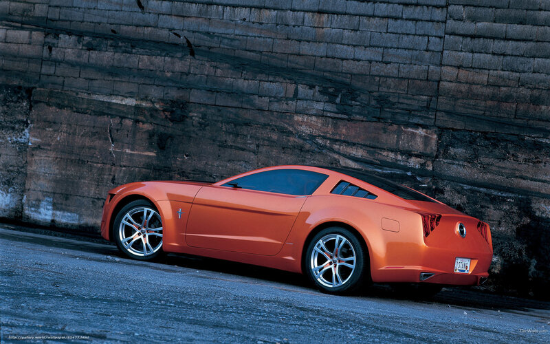 Orange Concept Car — Dramatic, Photograph, Brick Wall