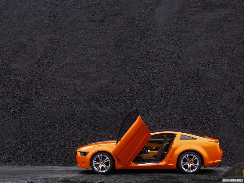 Orange Concept Car — Dramatic, Photograph, Car Door, Gravel Wall