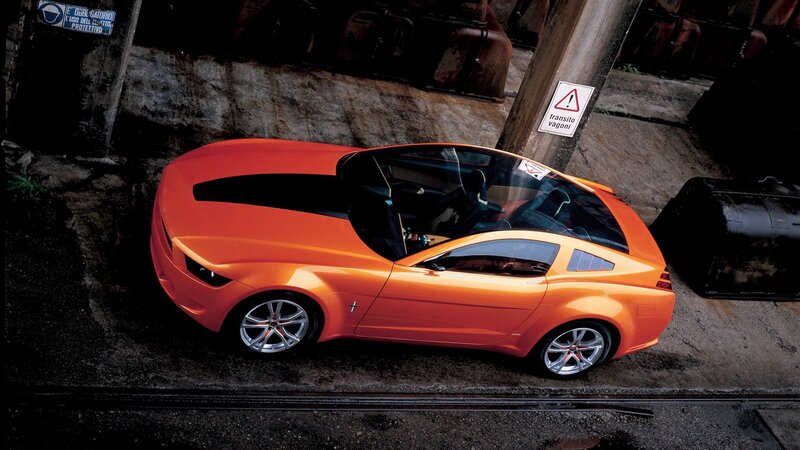 Orange Concept Car — Dramatic, Photograph, Rail Tracks