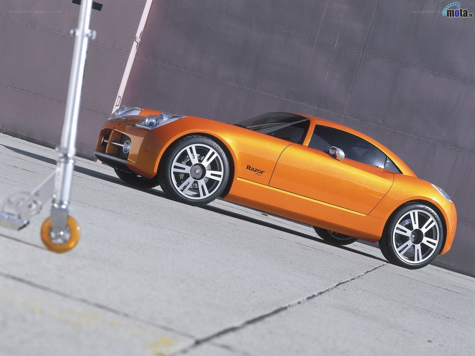 Orange concept car on concrete