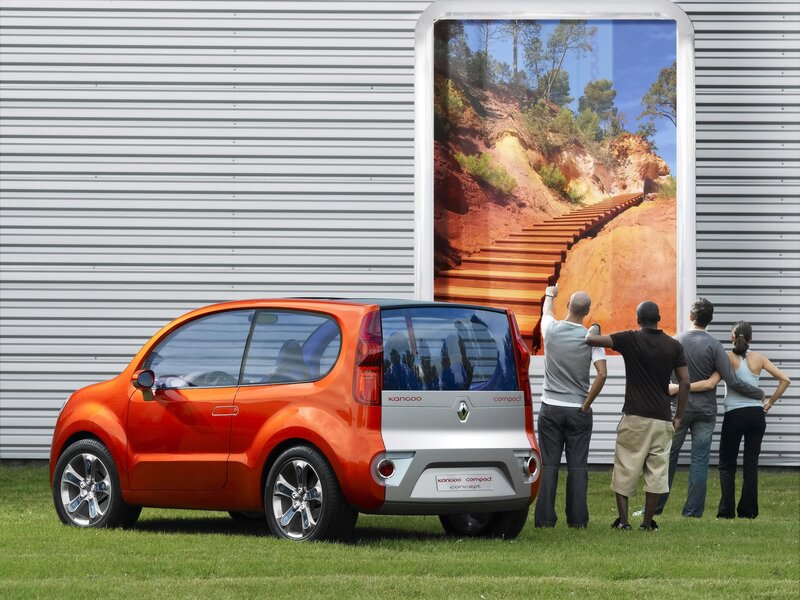 Orange concept car on grass