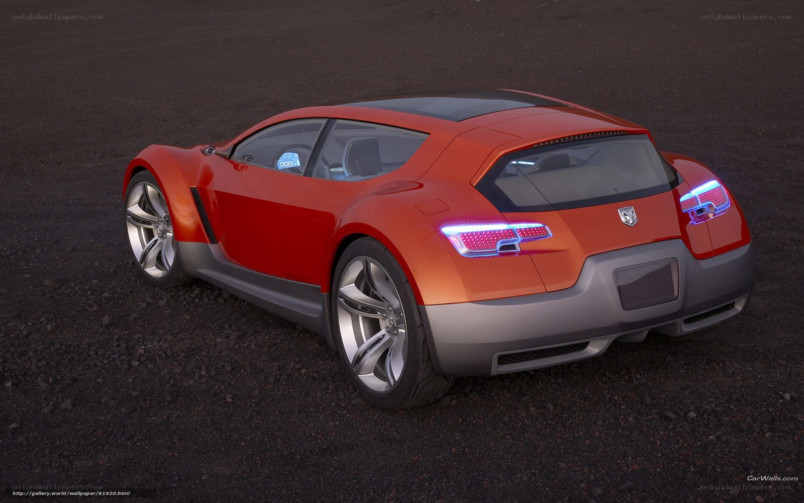 Orange concept car on gravel