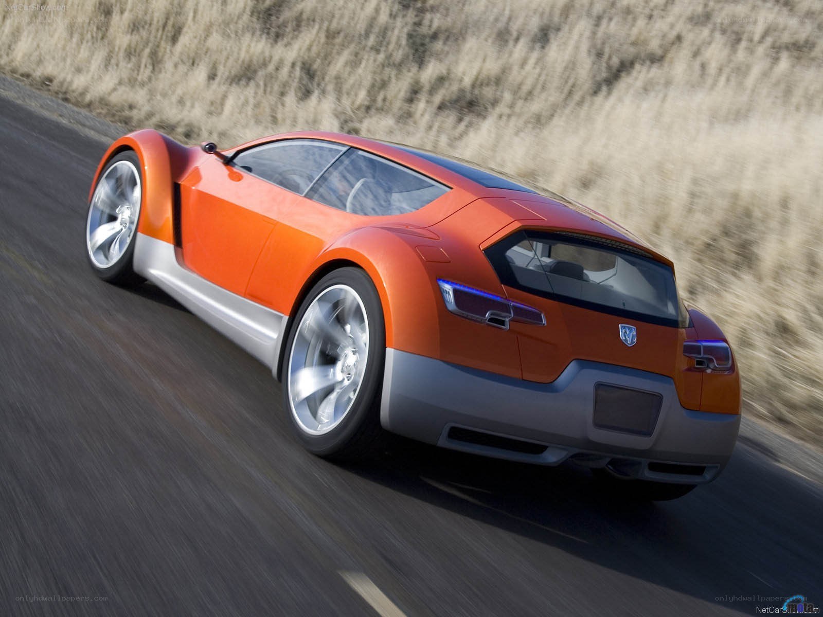 Orange concept car on road